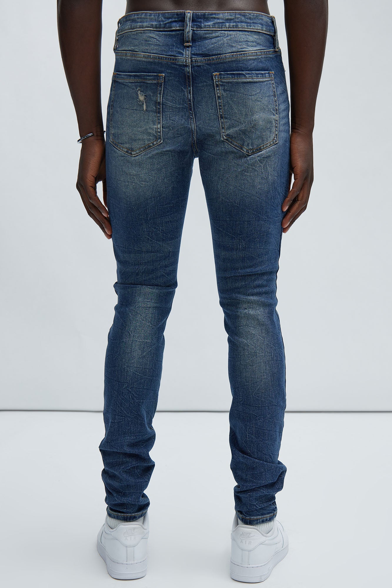 Primary Distressed Stacked Skinny Jeans - Dark Wash