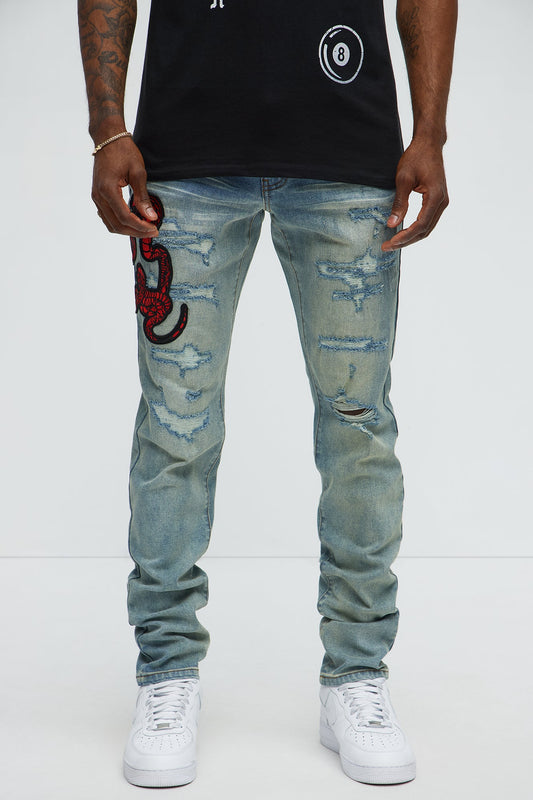 Side Snake Rip And Repair Stacked Skinny Jeans - Vintage Blue Wash