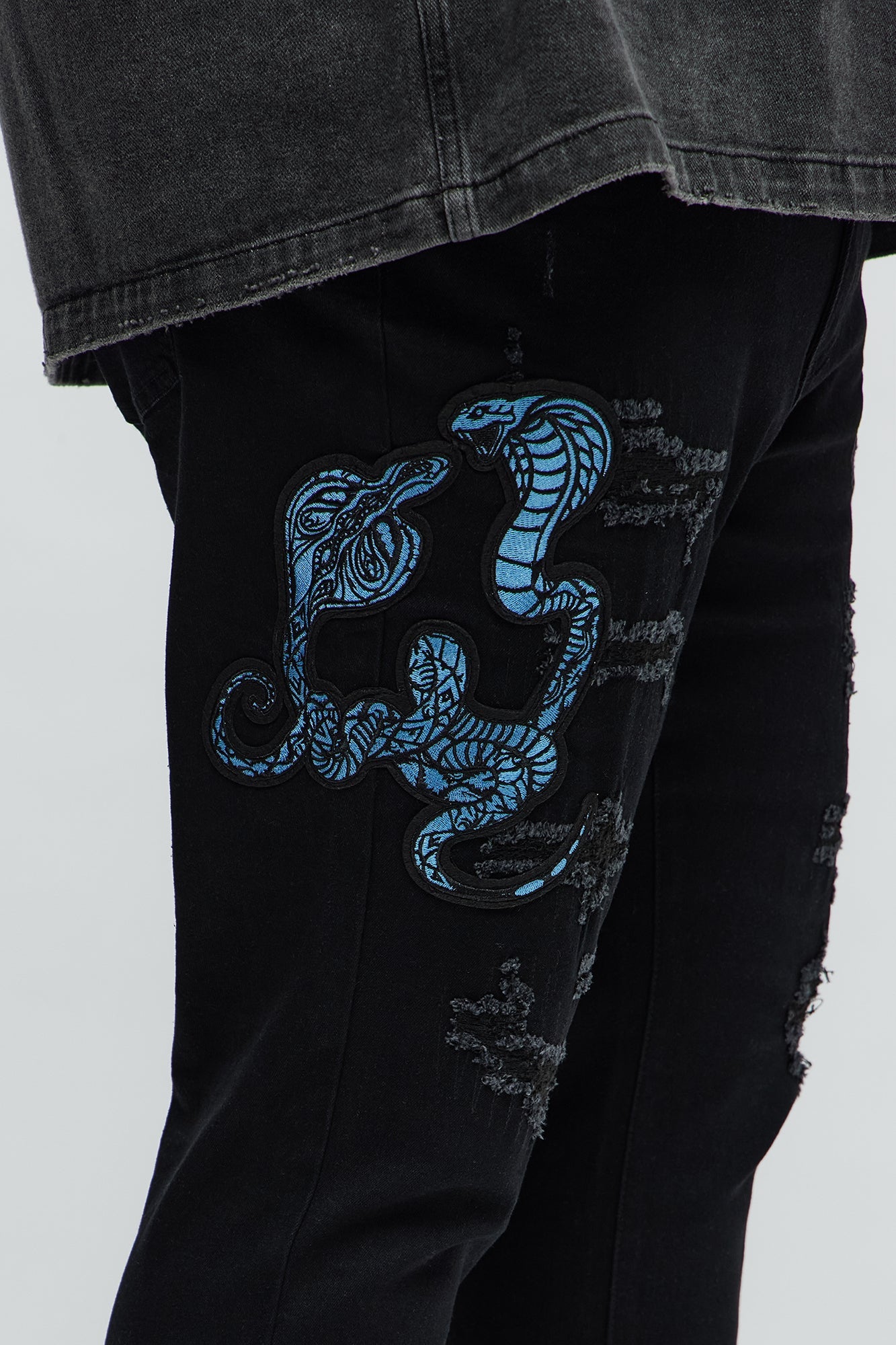 Side Snake Rip And Repair Stacked Skinny Jeans - Black